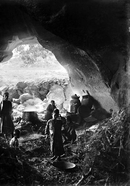 PALESTINE: CAVE DWELLING. The cave dwelling of gunpower makers in Bayt Jibrin, Palestine. Stereograph, early 20th century