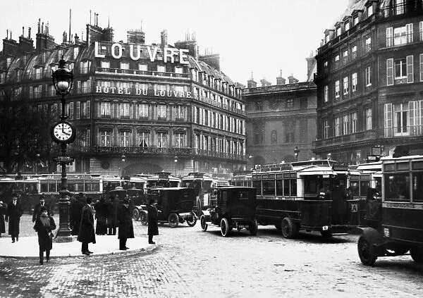 PARIS: TRAFFIC JAM, c1920. A traffic jam in front of the Hotel du Louvre at the Palais Royal, Paris, France. Photograph, c1920