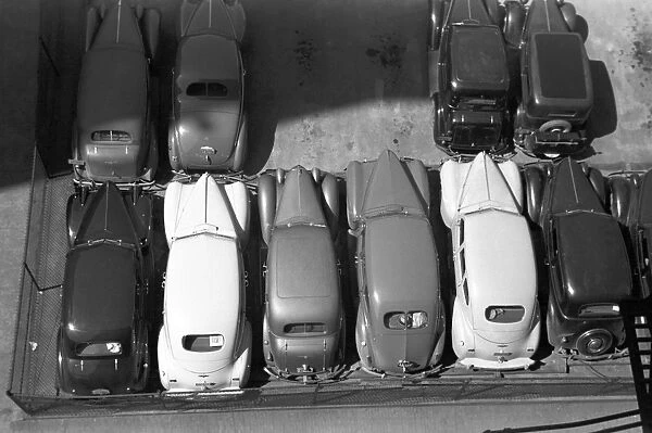 PARKING LOT, 1940. Aerial view of parked automobiles in Des Moines, Iowa