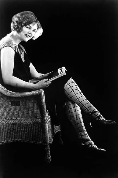 PATTERNED STOCKINGS, 1920s. Model wearing patterned stockings coordinated with her dress