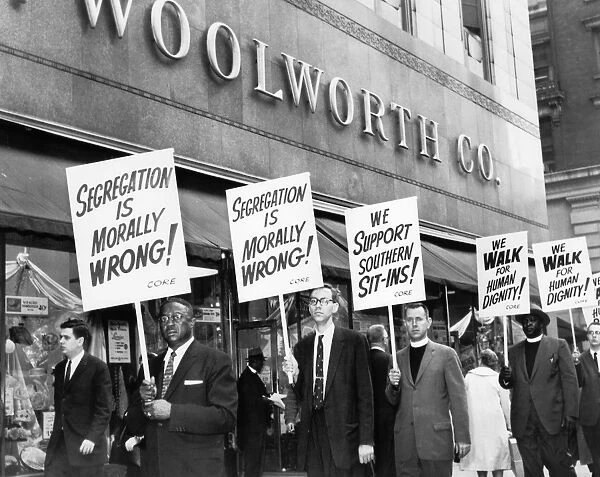 Picket line in front of the Woolworth Building in New York City, 14 April 1960. The majority of the picketers are ministers, protesting the stores lunch counter segregation at southern branches in its chain
