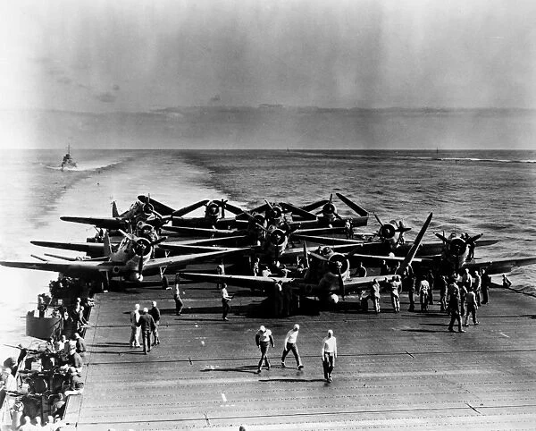 Pilots and crew preparing fighter planes aboard the USS Enterprise prior to their take-off for the Battle of Midway, 3-6 June 1942. Only four of the planes would return