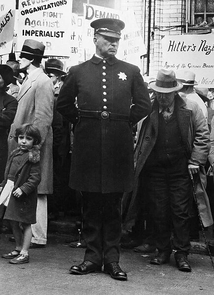 POLICE AND PROTESTERS, 1936. A police officer and protesters at a political gathering