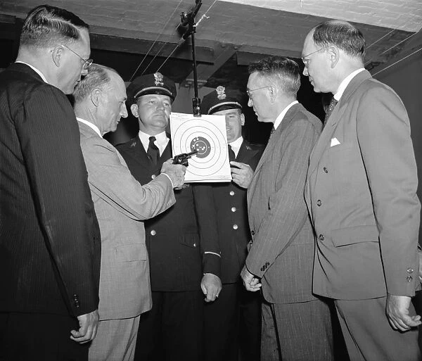 POLICE: TARGET RANGE, 1940. Chief Frank J. Wilson (right) and Assistant Chief Joseph E