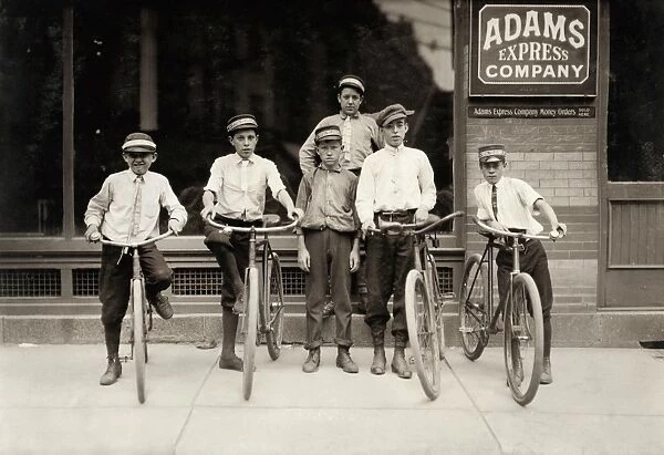 POSTAL MESSENGERS, 1911. A young group of Postal Messengers in Norfolk, Virginia. Photograph by Lewis Hine, June 1911