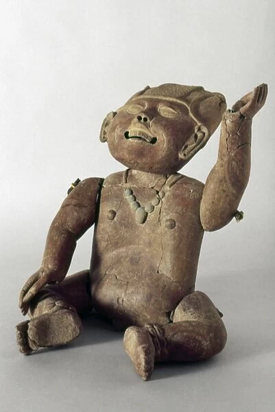 Pre-Columbian clay sculpture of a child with movable limbs and head, from Tierra Blanca, Veracruz, Mexico, 550-950 A. D
