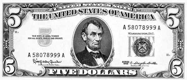 President Abraham Lincoln on the front of a U.s five dollar note, 1963
