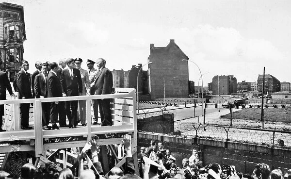 President John F. Kennedy and German Chancellor Konrad Adenauer at Checkpoint Charlie by the Berlin Wall during Kennedys visit to West Berlin on 26 June 1963