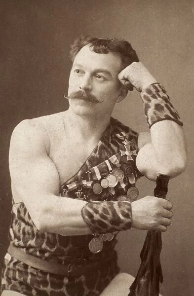 Professor Louis Attila, stage name of Ludwig Durlacher (1844-1924), American (German-born) strong man, body-builder, and gymnasium proprietor. Photographed c1900