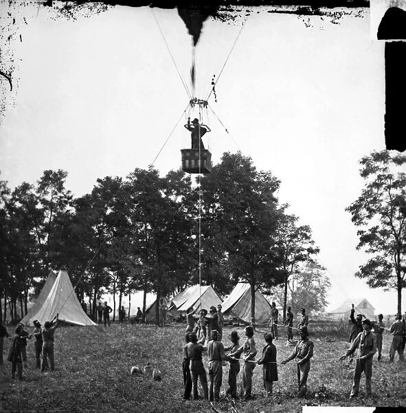 Professor Thaddeus Sobieski Coulincourt Lowe behind Union lines observing the Battle of Fair Oaks, Virginia, from his balloon Intrepid, 31 May 1862