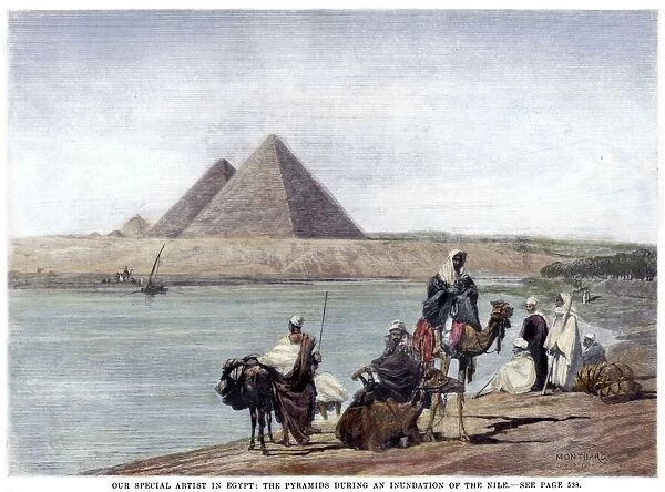 PYRAMIDS AT GIZA, 1882. The pyramids at Giza, Egypt, during an inundation of the Nile River. Wood engraving, English, 1882