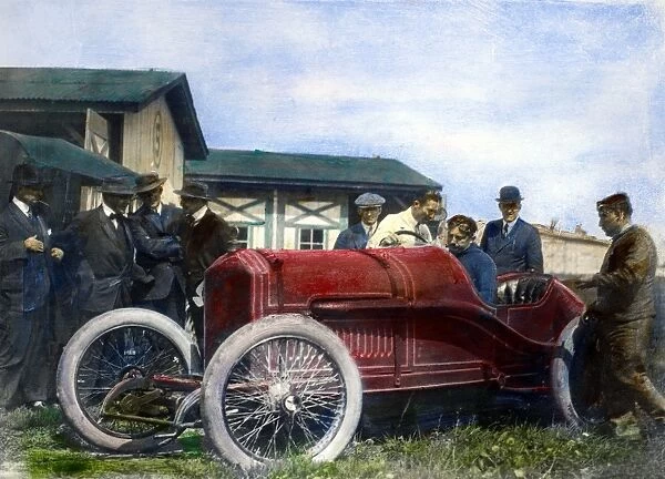 RACE CAR, 1914. French racing driver Georges Boillot behind the wheel of a Peugeot, receiving instructions from his teammate, Jules Goux (in white), prior to the 1914 Indianapolis 500 mile race
