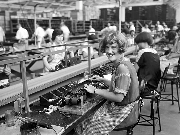 RADIO FACTORY, c1925. Worker Mary Ramsey beginning the assembly of a radio set