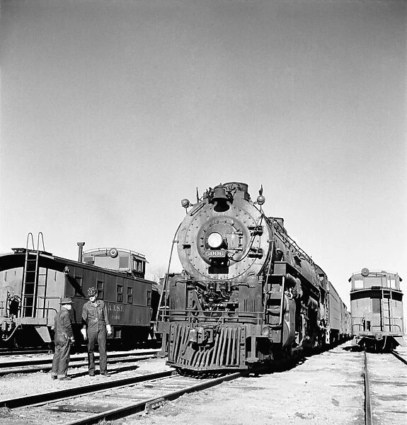 RAILROAD YARD, 1943. Easternbound train about to leave the Atchison, Topeka