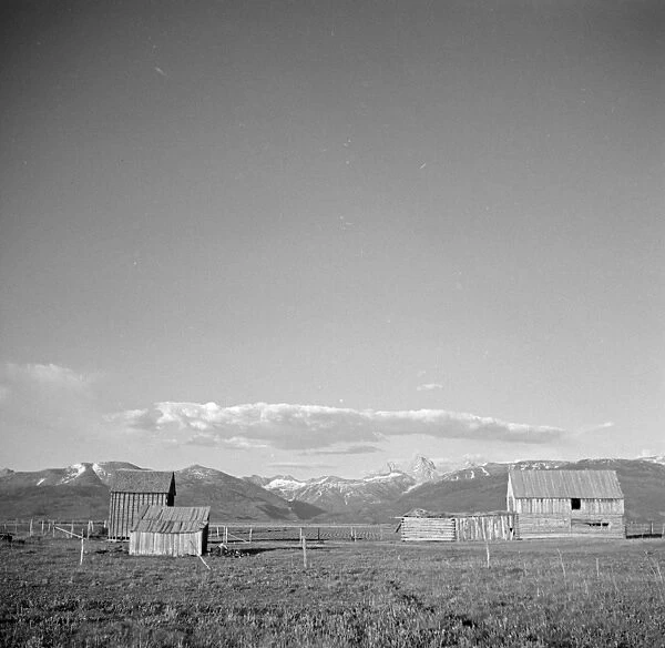RANCH, c1936. View of ranch buildings near the mountains, possibly in Montana. Photograph