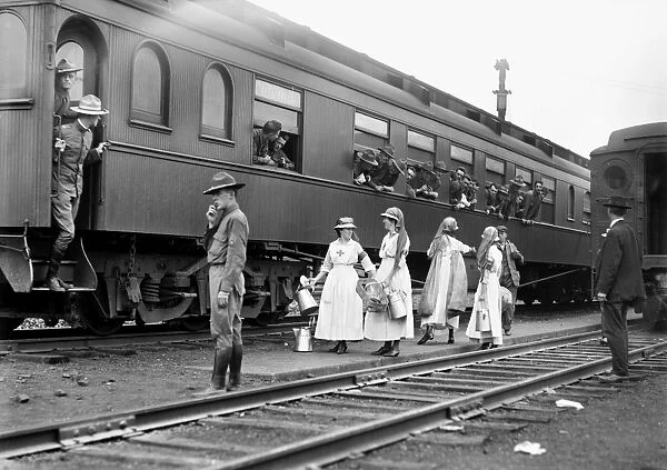 RED CROSS, c1918. American Red Cross workers near troop train, c1918