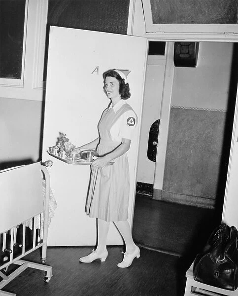 RED CROSS, c1942. A Red Cross nurses aid working in an American hospital as part