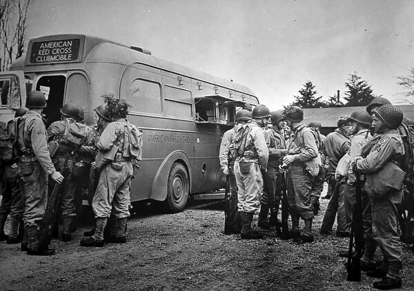 RED CROSS: CLUBMOBILE. American Red Cross clubmobile serves coffee, doughnuts, and other items to soldiers in isolated training camps. Photographed c1942