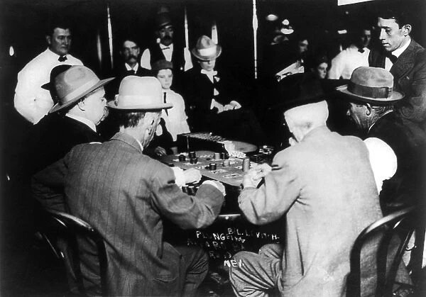 RENO: GAMBLING, 1910. Men gambling on a game of faro at a casino in Reno, Nevada, 1910