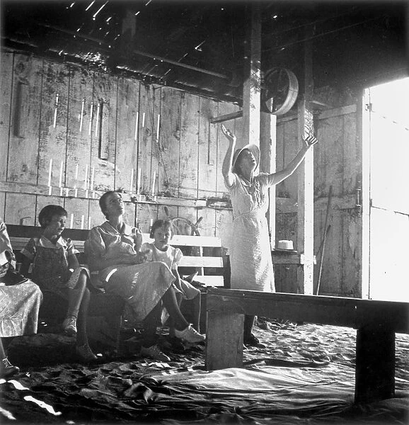 REVIVAL MEETING, 1938. A revival meeting in a garage at Dos Palos, California