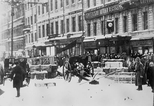 REVOLUTION OF 1917. Field guns under a red banner at a barricade in Petrograd, Russia, 12 March 1917