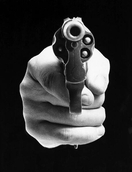 REVOLVER AIMED AT YOU. Photograph, American, mid 20th century