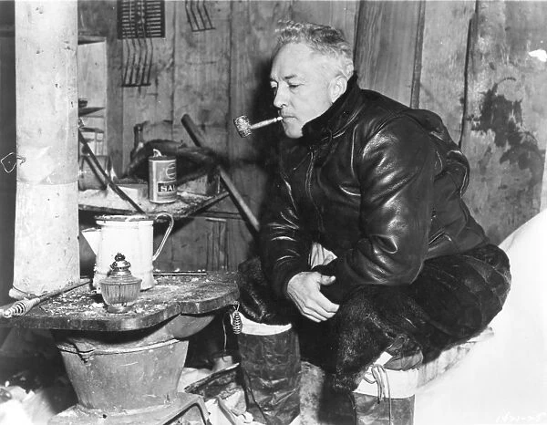 RICHARD EVELYN BYRD (1888-1957). American polar explorer. Trying his old corncob pipe, retrieved after 17 years, at Little America in the Antarctic in 1946