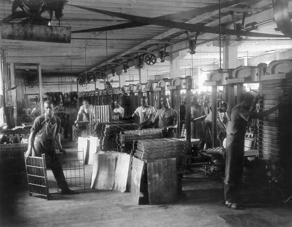RICHMOND: TOBACCO PRESS. African Americans operating pot presses at the T