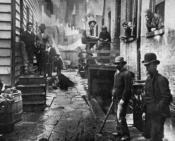 RIIS: BANDITS ROOST, 1887. An alley at 59 Mulberry Street in New York City. Photographed by Jacob Riis, c1887