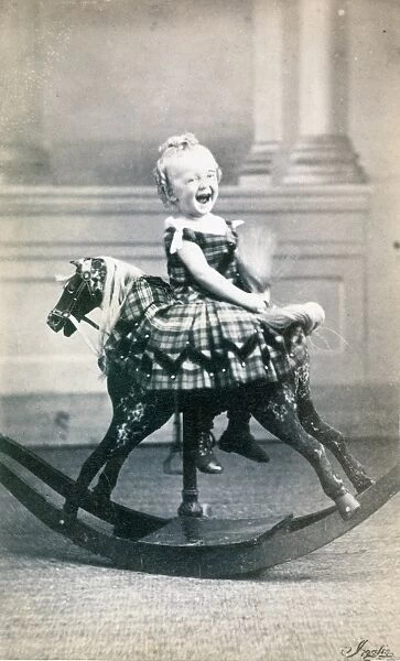ROCKING HORSE, c1870. A young girl on a rocking horse. Original carte-de-visitie photograph