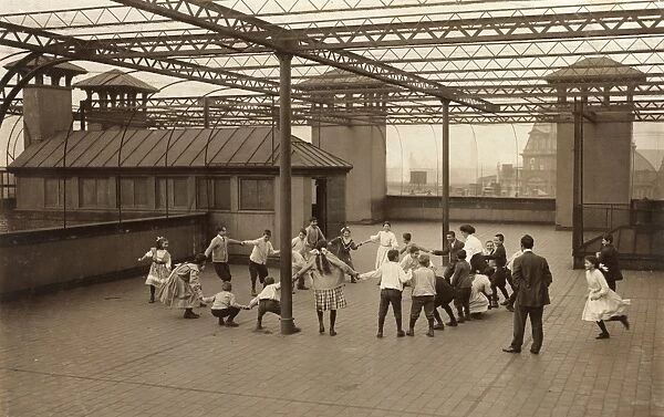 ROOF GARDEN RECESS, 1909. Immigrant children learning to play games on the roof