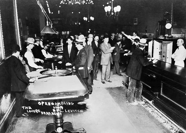 Roulette tables and a bar at the Louvre casino in Reno, Nevada, c1910