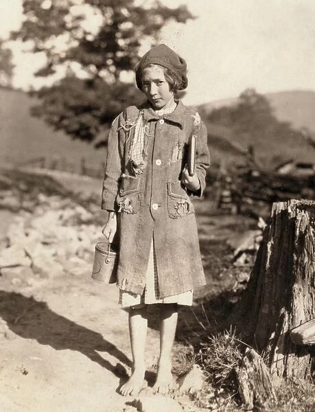 RURAL SCHOOL GIRL, 1921. A country school girl walking barefoot to the Buckeye School