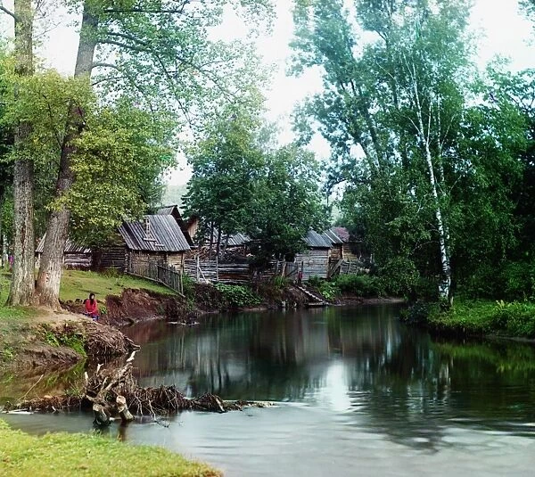 RUSSIA: LOG CABINS, 1910. A log cabin village along the Sim River near the Asha-Balashovskii