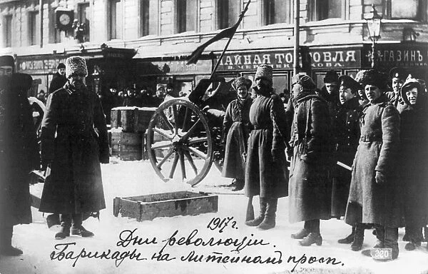 RUSSIAN REVOLUTION, 1917. People in front of a barricade on a street in the Liteinyi Prospect in Petrograd, Russia, 1917