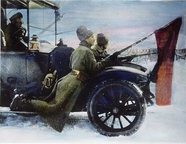 RUSSIAN REVOLUTION, 1917. Pro-Bolshevik soldiers, with red flags fixed to their bayonets, patrolling the streets of Petrograd in March, 1917, from a car commandeered from the Provisional Government