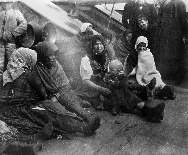 S. S. AMSTERDAM, c1910. Immigrant women and children from Eastern Europe, sitting