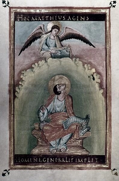 SAINT MATTHEW Writing his gospel at the dictation of an angel. Miniature from a 9th century French manuscript