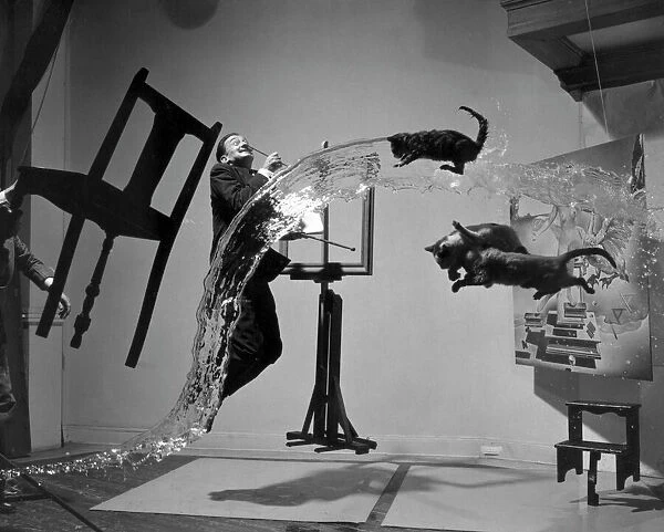 SALVADOR DALI (1904-1989). Spanish painter. Photographed with objects, including cats and water caught in surreal motion. Photographed by Philippe Halsman, c1948