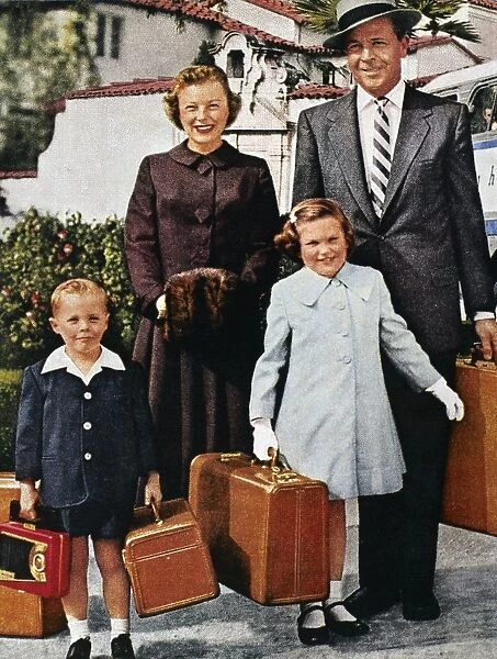 SAMSONITE AD, 1956. An American family ready for travel, in an advertisement for Samsonite luggage and Greyhound bus travel, 1956