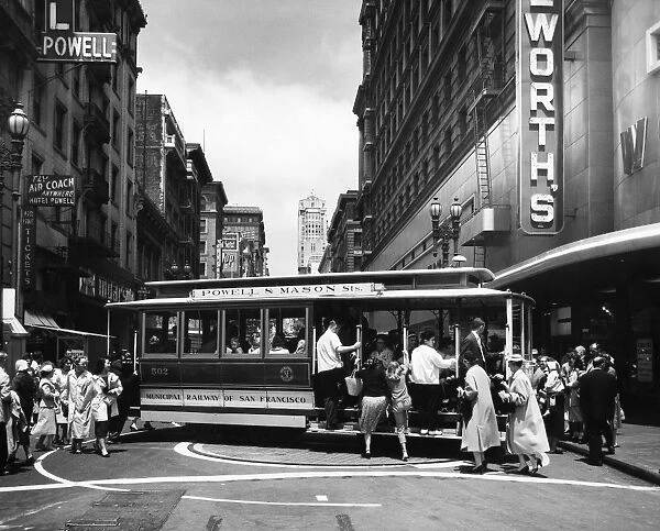 SAN FRANCISCO: CABLE CAR. A cable car on the turntable at the intersection of Powell and Market Streets in San Francisco, California. Photographed c1950