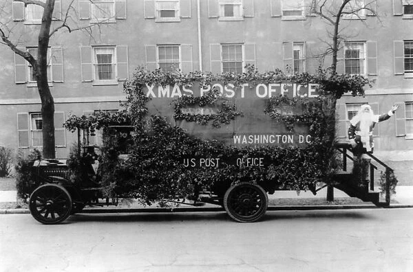 SANTA CLAUS, 1921. A truck decorated in an appeal for early mailing during the Christmas season