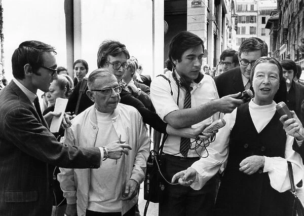 SARTRE & BEAUVOIR, 1970. Jean-Paul Sartre and Simone de Beauvoir speaking to reporters in Paris after their release from a police station, where they were detained for having distributed La cause du Peuple (The Peoples Cause), a banned leftist publication, 26 June 1970