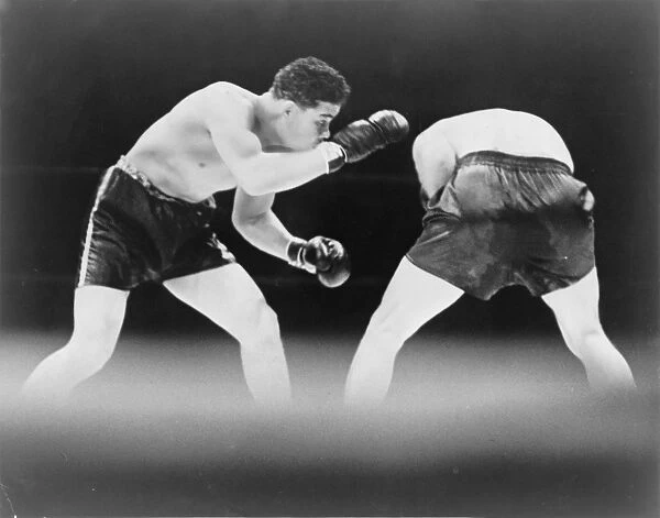 SCHMELING VS. LOUIS, 1936. Joe Louis looks for an opening to land a punch during