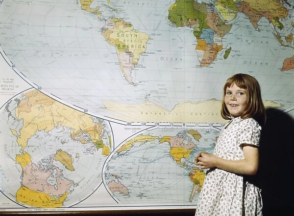 SCHOOL GIRL, 1943. A school girl in front of a map in San Augustine County, Texas