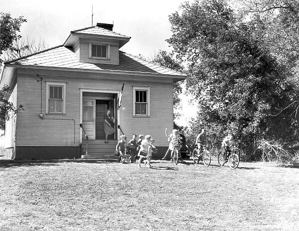 SCHOOLHOUSE, 1939. Children leaving school for the day, Grundy County, Iowa. Photograph