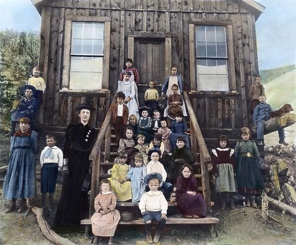 SCHOOLMISTRESS, 1893. Miss Blanche Lamont with her school in Hecla, Montana, October 1893