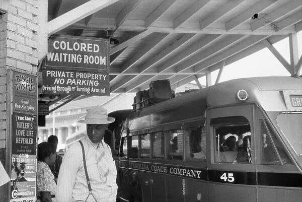 SEGREGATED BUS STOP, 1940. Scene at a segregated bus stop in Durham, North Carolina