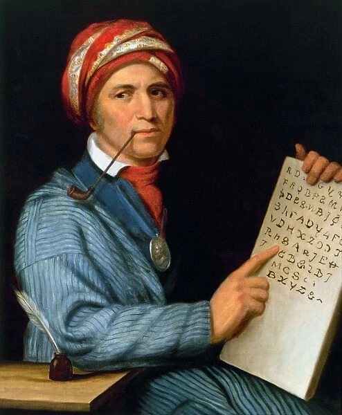 SEQUOYA (1770?-1843). Native American scholar, with his printed Cherokee alphabet