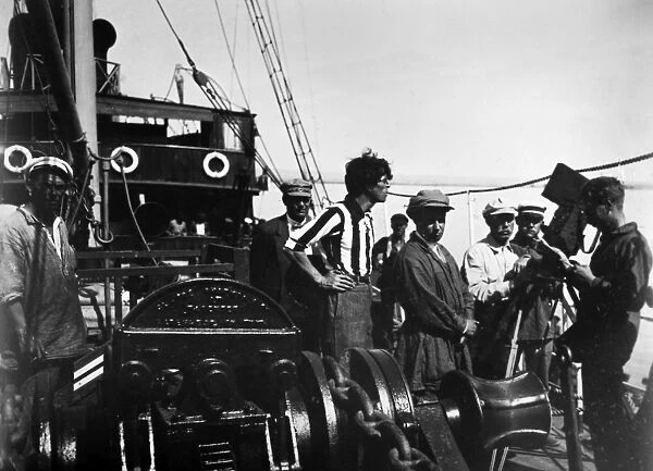 SERGEI EISENSTEIN (1898-1948). Russian motion-picture director. Eisenstein (in cap, right foreground) on the set of the film Battleship Potemkin, 1925